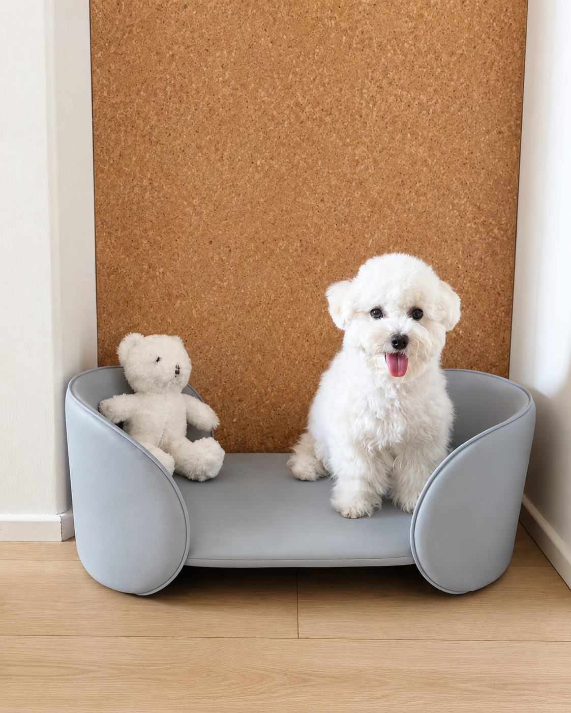 Henry Pet Sofa Bed in Powder Blue with a small white dog in a room